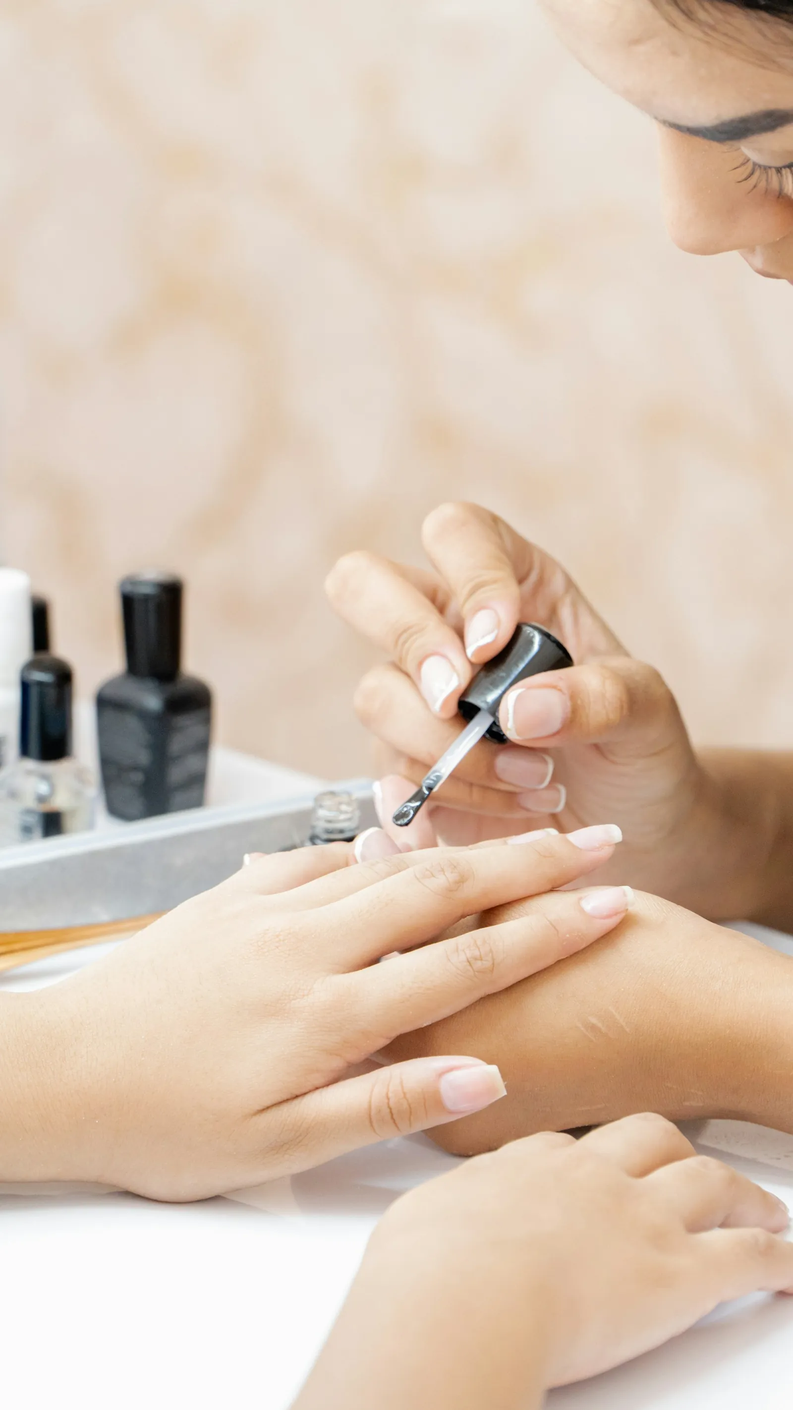 Child's hand getting a gentle manicure