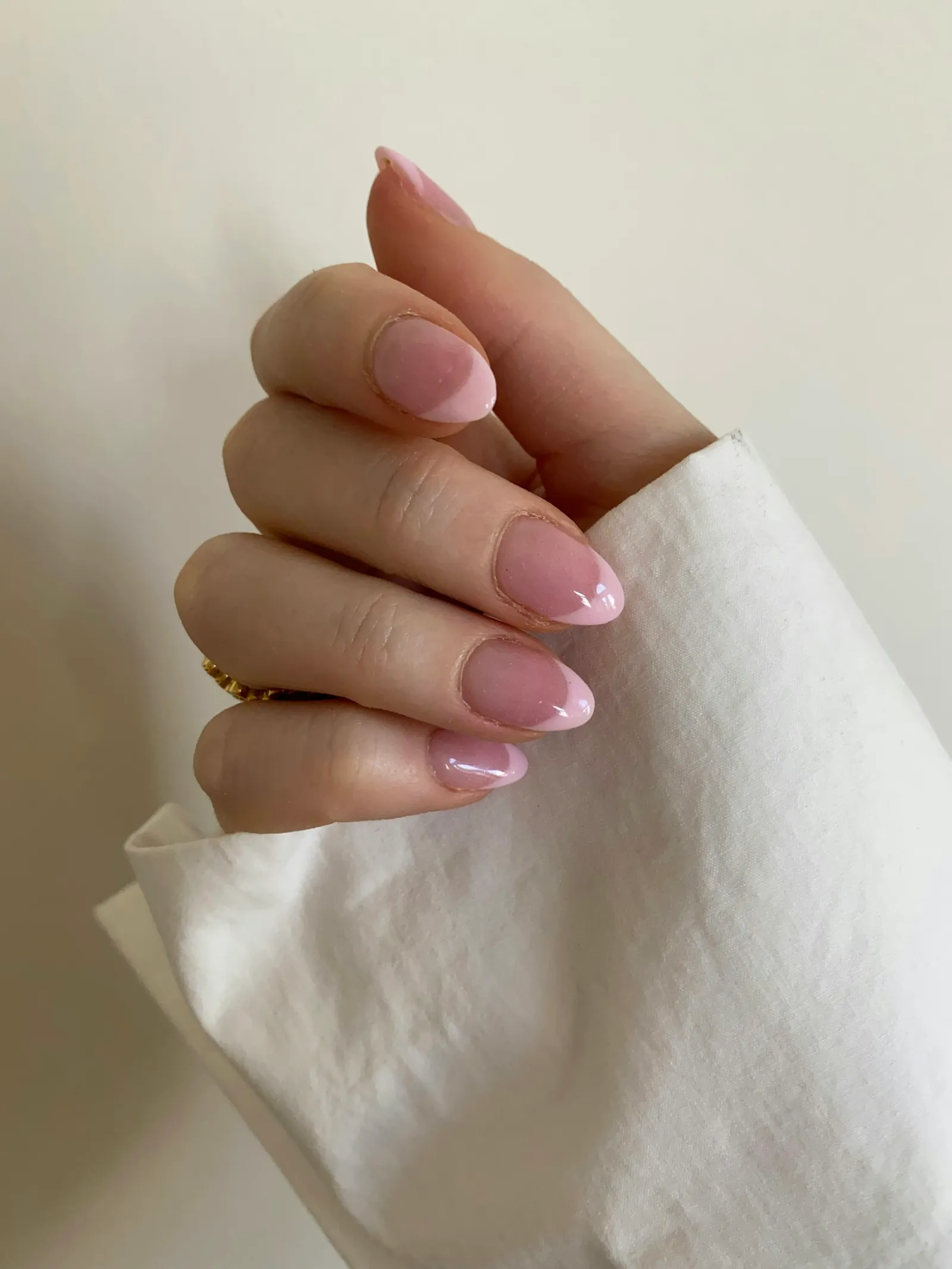 Natural-looking soft pink manicure on short nails