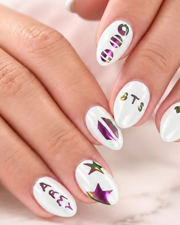 White iridescent chrome almond nails with holographic star decals by Jasmine Nails & Spa